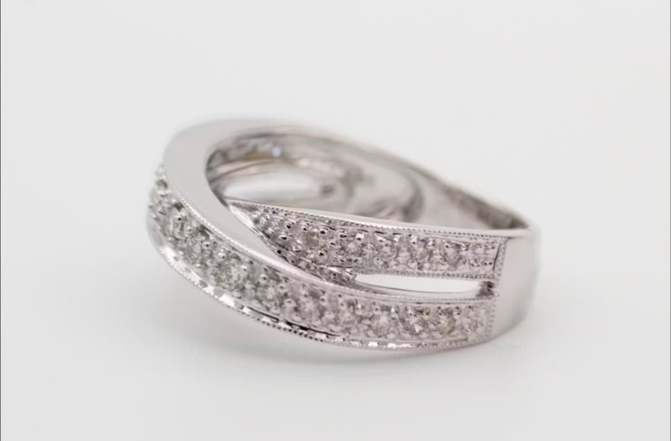 Diamond Ring Setting Jewelry Repair: White gold band, multiple stones.