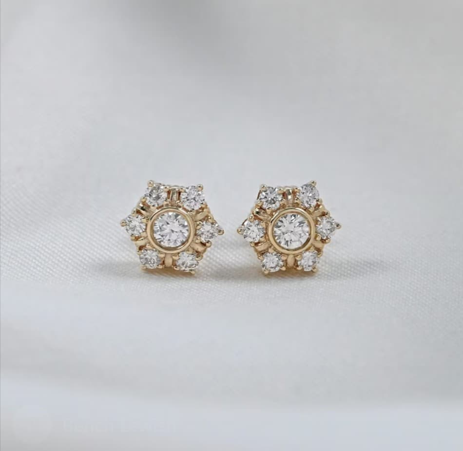 Gold and diamond stud earrings; jewelry sales and repair services.