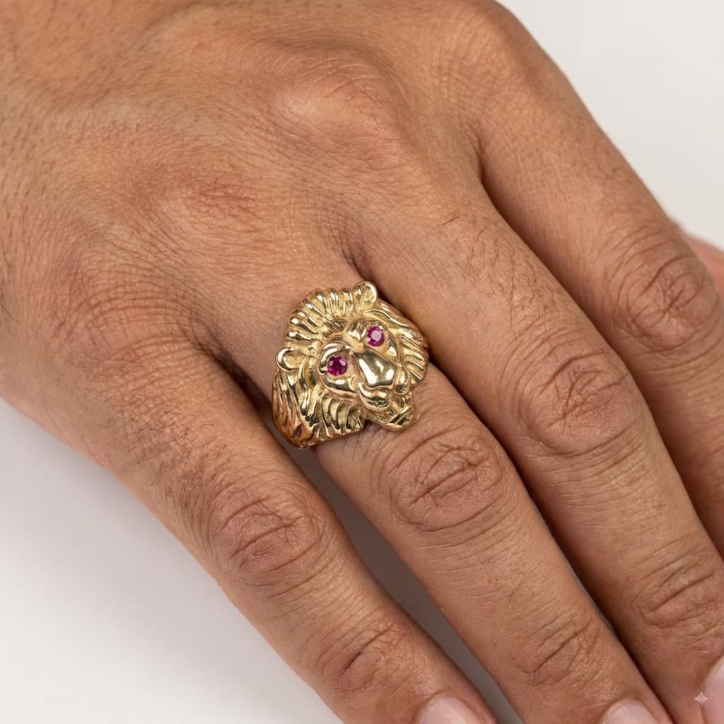 Gold lion ring with ruby eyes, jewelry sales and repair.